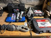 Overall view showing DualSaw case, Craftsman Nextec drivers, circular saw, Husky cases and Craftsman recip saw