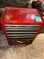 Top view of Craftsman red rolling tool chest showing drawer fronts and wear
