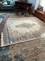 Full view of rug partially unrolled in room