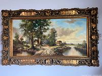 Front view of framed painting showing full artwork and frame details