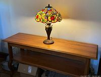 Lamp illuminated on wooden console table