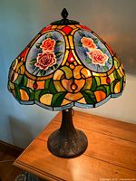 Full view of lamp lit showing shade colors and base