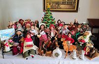 Full lot view with caroler figures, ceramic tree, reindeer, vases, candle holders