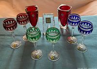 Full set of six cut-to-clear hock glasses, two ruby vases and crystal desk clock