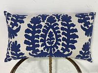 Front view of rectangular pillow displaying full embroidered design