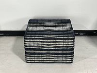 Front view of navy striped square ottoman