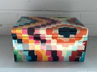 Front view of multicolour glass jewelry box