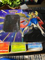 Large Zamazenta tin, card stacks in plastic boxes