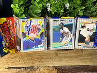 Full rack pack showing three card stacks, Pat Borders and Gerald Perry visible, intact seal