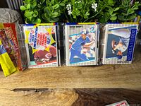 Full rack pack front showing three visible cards and sticker information