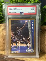 Front of PSA-encapsulated Shaquille O’Neal Fleer rookie card showing grade label