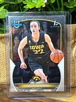 Front of Caitlin Clark Bowman Chrome rookie card in protective sleeve