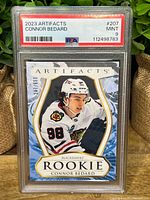 Front of PSA-slabbed 2023 Artifacts Connor Bedard Rookie card showing grade and serial number