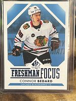 Front of Connor Bedard Freshman Focus rookie card showing player image, team logo, SP Authentic logo, and textual details