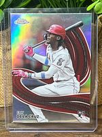 Front view of Elly De La Cruz Topps Chrome Strokes refractor rookie card in sleeve