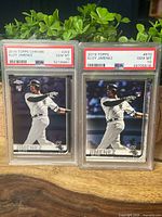 Both PSA-slabbed Eloy Jimenez cards side by side