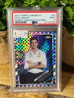 Front view of PSA-slabbed Toto Wolff purple checker flag refractor card