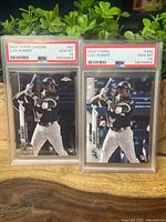Both PSA 10 Luis Robert rookie cards side by side in slabs