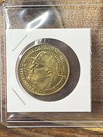 Obverse view of coin in holder