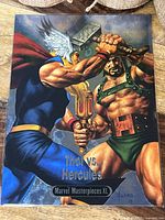 Front view of the 5x7 Marvel Masterpieces XL spectrum foil card showing Thor vs Hercules artwork