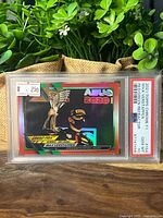 Front of PSA slab displaying card, price sticker visible