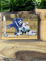 Front of Mitch Marner Game Dated Moments Gold parallel card