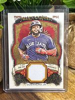 Front of 2024 Topps Allen & Ginter Vladimir Guerrero Jr. relic card showing image and memorabilia swatch