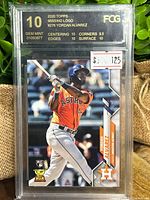 Front view of encapsulated Yordan Alvarez rookie card showing grade label and card image