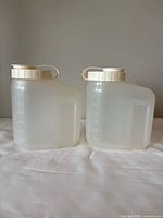 Two translucent Tupperware containers side by side