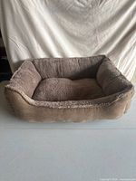 Front view of rectangular brown plush pet bed