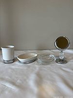 All four bathroom accessories lined up