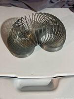 Metal slinky extended in arch shape