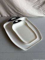 Both cutting boards stacked; shows material, color, handles