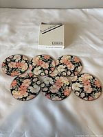 All six coasters laid out face up with box