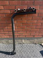 Full view of L-shaped hitch rack showing hitch shank and cradle bar