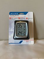 Front view of sealed AcuRite humidity monitor in packaging