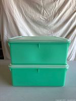 Stacked view of both containers with lids on showing size and color