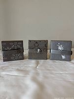 Three coaster sets side by side