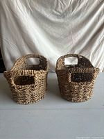Front view of both wicker baskets showing weave and handles