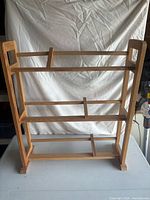 Front view of wooden bookshelf showing three shelves