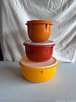 All three stacked showing colours and one lid