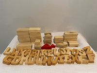 all wooden letters and blocks arranged on table