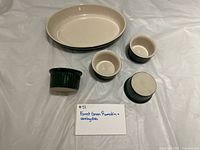 Top view of oval dish and four ramekins showing color and interiors