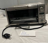 Front view of Breville toaster oven with power cord visible