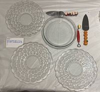 Top-down view showing pie dish, three bubble plates, utensils