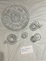 All five Yugoslavian lead crystal pieces displayed: round platter, two creamers, small bowl, goblet