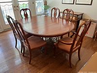 Full view of table with six chairs around it