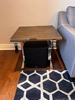 Side table front view beside sofa