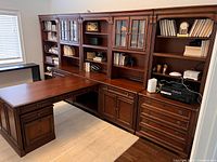 Overall view showing L-shaped desk attached to four matching wall units