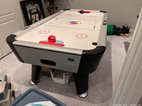 Full view of Sportcraft Turbo air-hockey table, accessories visible